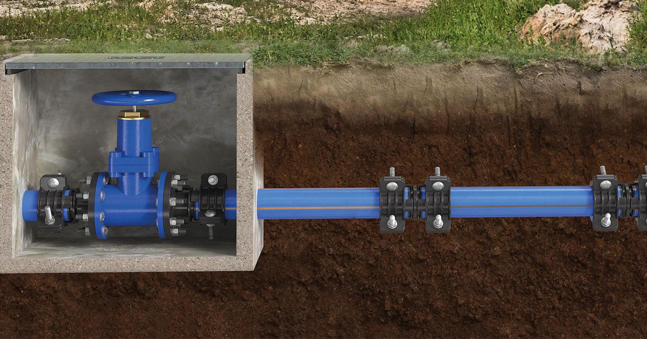 Cross-section of an underground pipeline with a blue gate valve in a concrete chamber and mechanical couplings