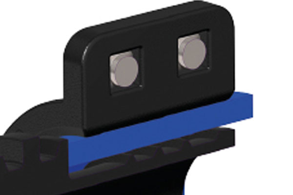Close-up of a black bracket with two silver pins mounted above a blue rail