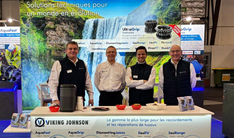 Four representatives standing behind a Viking Johnson exhibition stand