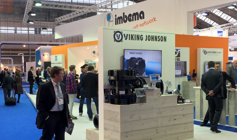 Viking Johnson exhibition stand at a trade show displaying pipe fittings and digital product demonstrations