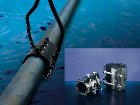Subsea pipe repair clamp attached to an underwater pipeline, with an inset showing two clamps up close