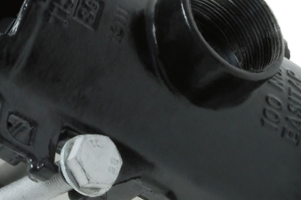 Close-up of a threaded outlet port and silver fastening bolt on a black pipe saddle fitting