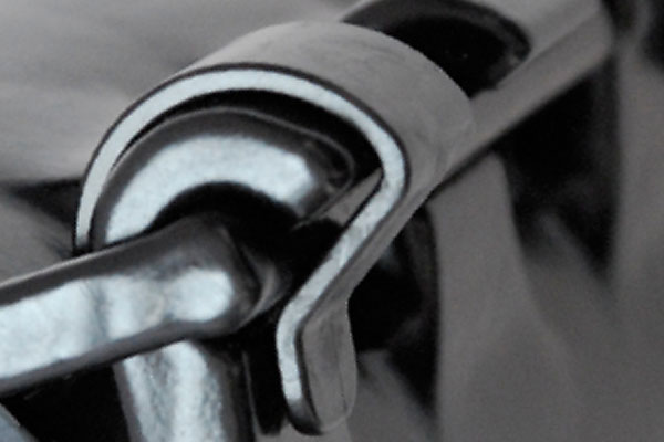 Close-up of a silver metallic hinge and clasp mechanism