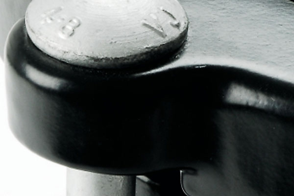 Close-up of a silver bolt stamped 4-8 and VJ secured to a black metal component