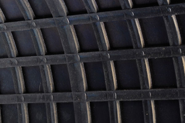 Close-up of a black plastic grid pattern