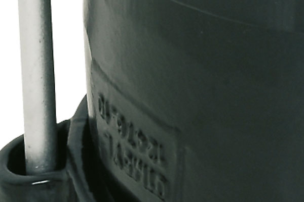Close-up of a vertical metal guide rod inserted into a black housing collar