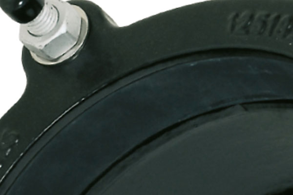 Close-up view of a black rubber component secured with a silver bolt and nut