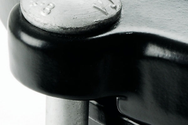 Close-up of a metal bolt secured into a black metal component