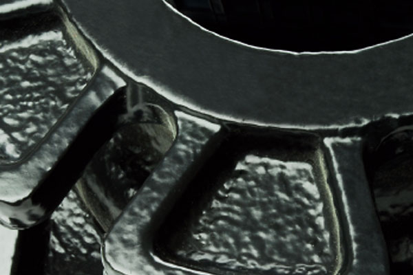 Extreme close-up of dark textured metal gears